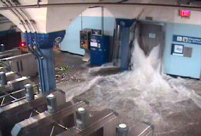 Floodwaters from Hurricane Sandy rush into the Port Authority Trans-Hudson's (PATH) Hoboken, New Jersey station through an elevator shaft